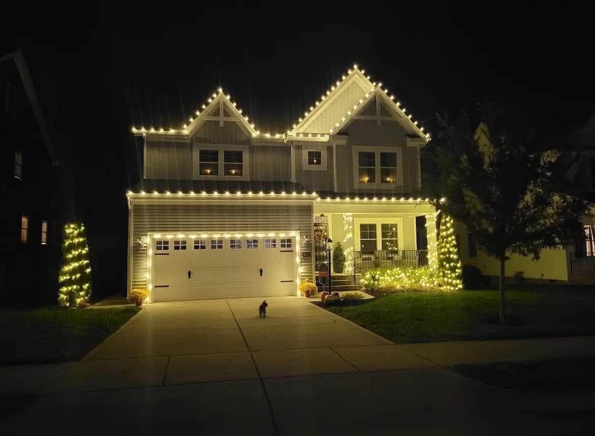Warm white over the garage bays — Christmas light installation by Mike’s Cincinnati Christmas Lights